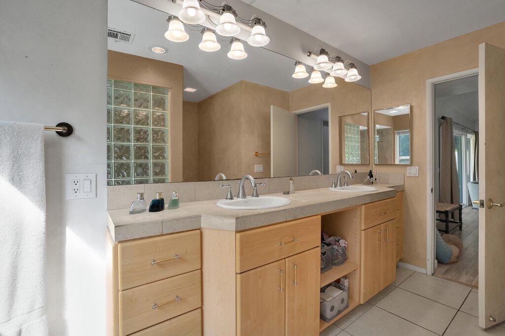 43761 Port Maria Road Bermuda Dunes, CA 92203 - Photo 28 of 50 a bathroom with a sink double vanity and a mirror