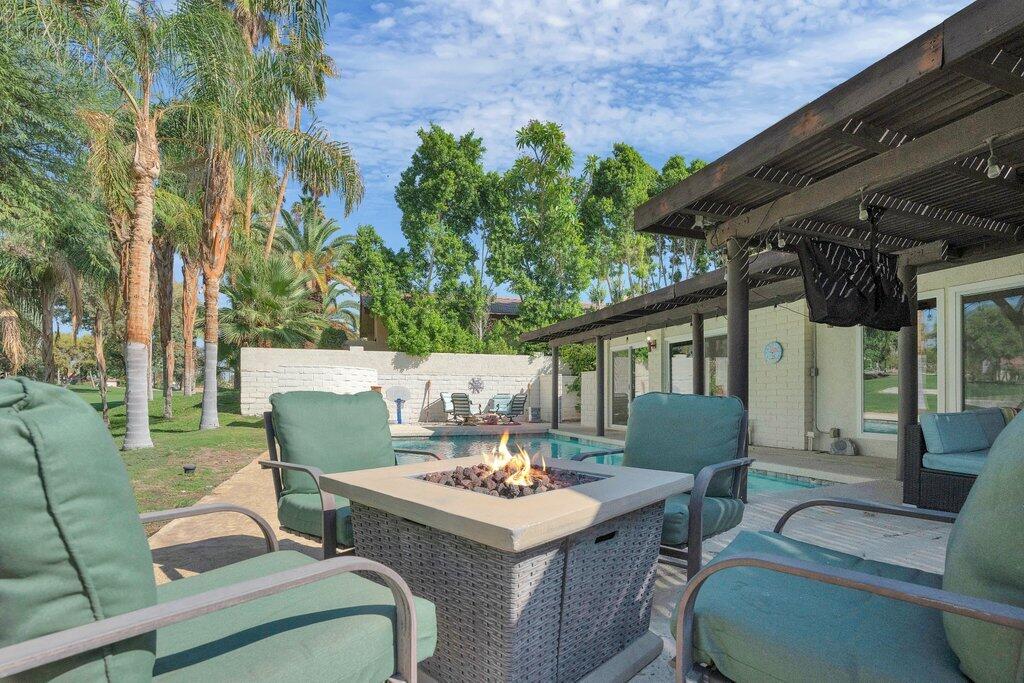 43761 Port Maria Road Bermuda Dunes, CA 92203 - Photo 3 of 50 a backyard of a house with a table and chairs