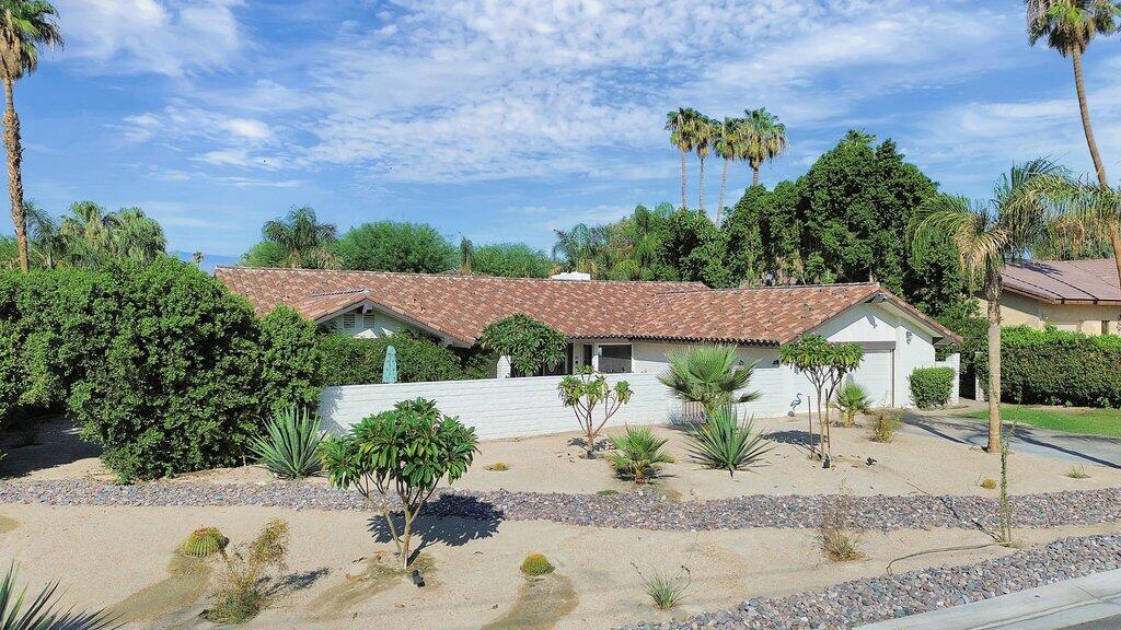 43761 Port Maria Road Bermuda Dunes, CA 92203 - Photo 40 of 50 a view of a house with a yard and sitting area