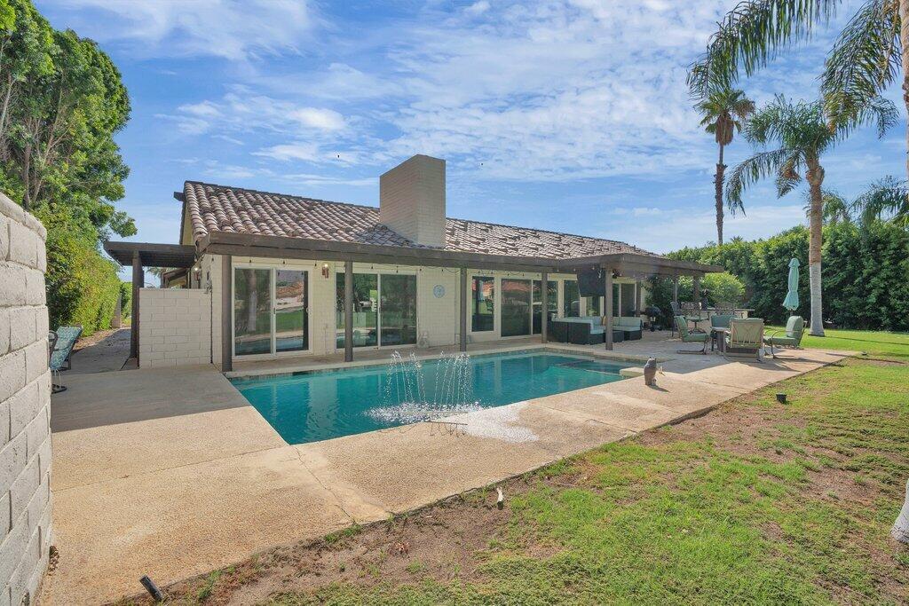 43761 Port Maria Road Bermuda Dunes, CA 92203 - Photo 4 of 50 a view of a house with swimming pool and a yard