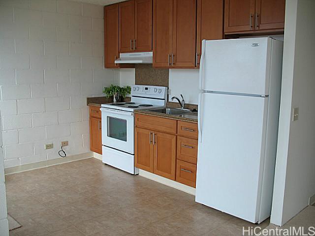 750 Kanoa Street, Unit 305 Honolulu, HI 96817 - Photo 1 of 1 a kitchen with stainless steel appliances granite countertop a refrigerator a stove a sink and dishwasher