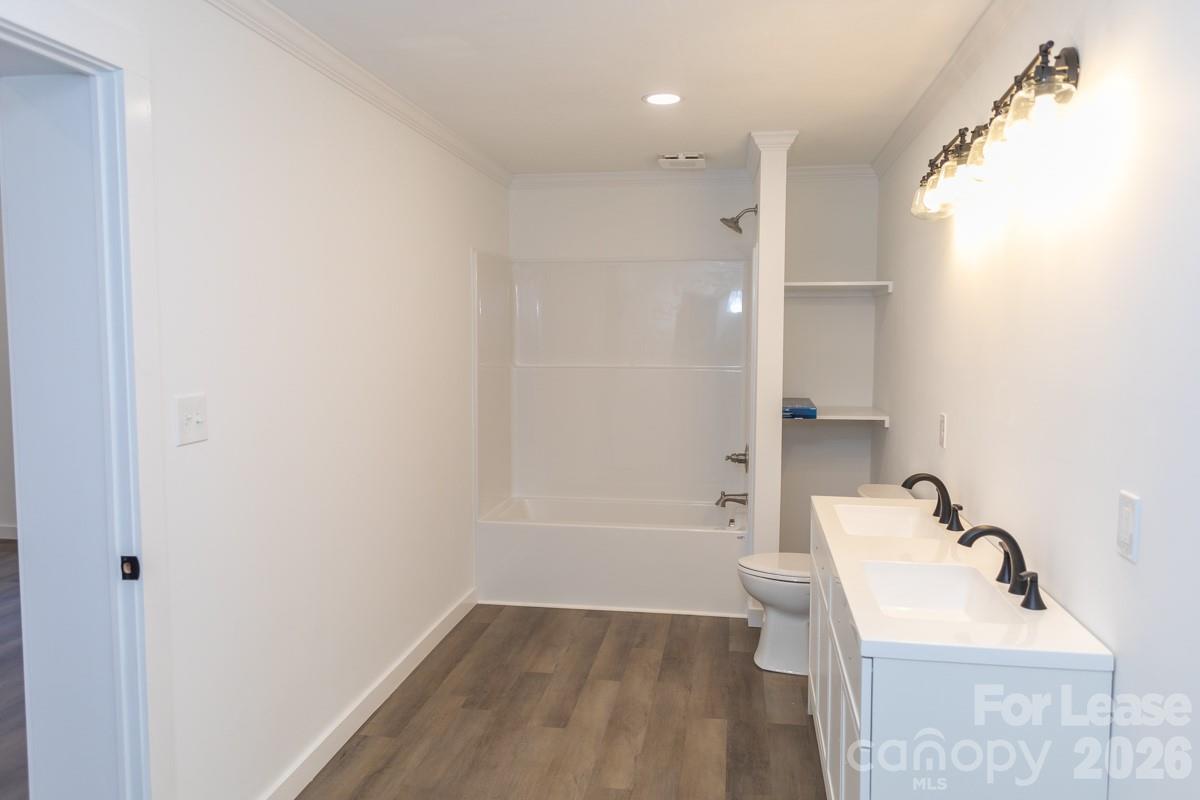 2375 Conley Road Morganton, NC 28655 - Photo 12 of 15 a bathroom with a sink toilet and shower