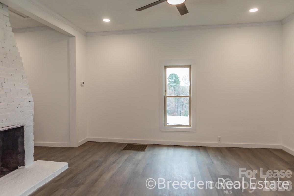 2375 Conley Road Morganton, NC 28655 - Photo 7 of 15 an empty room with wooden floor and windows