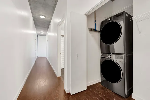 a view of a hallway with washer and dryer