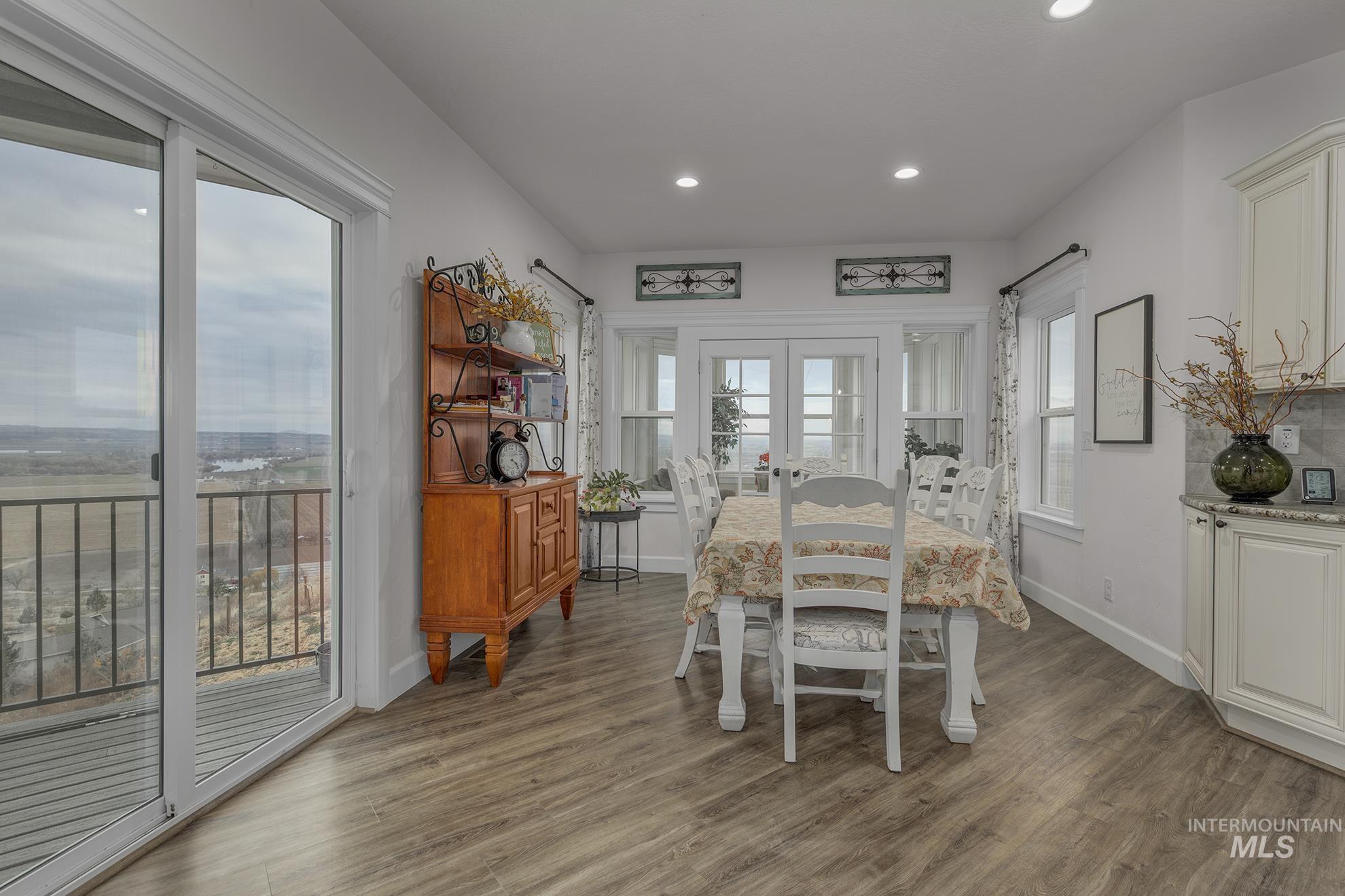 5631 Sunset Road Fruitland, ID 83619 - Photo 16 of 50 Dining space with dark wood-style flooring, french doors, and recessed lighting