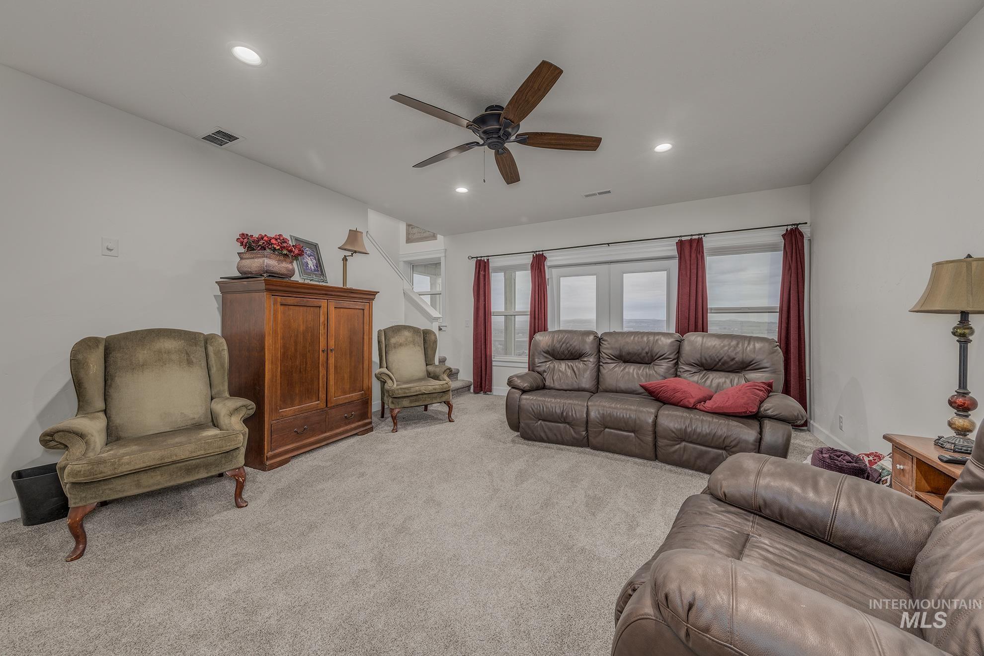 5631 Sunset Road Fruitland, ID 83619 - Photo 25 of 50 Living area featuring light colored carpet, a ceiling fan, and recessed lighting