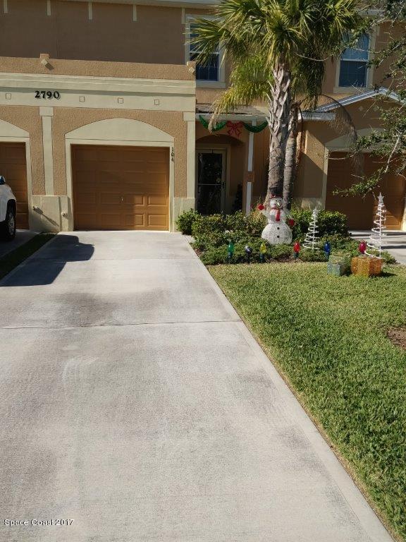 2790 Reston Street, Unit 104 Melbourne, FL 32935 - Photo 2 of 30 front view of a house with a yard