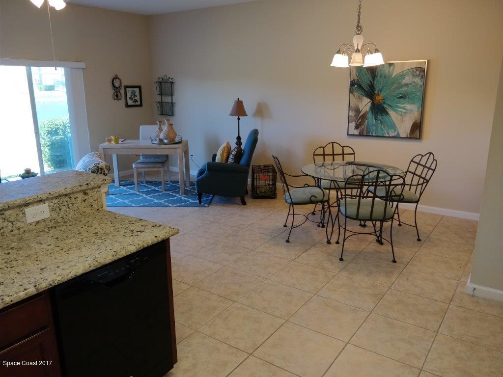 2790 Reston Street, Unit 104 Melbourne, FL 32935 - Photo 14 of 30 a living room with furniture and a wooden floor