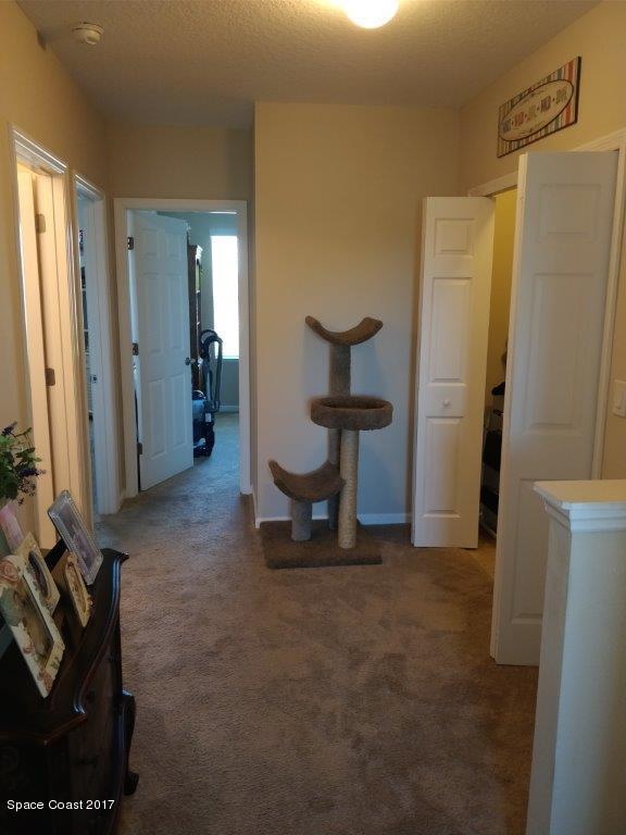 2790 Reston Street, Unit 104 Melbourne, FL 32935 - Photo 21 of 30 a view of room with furniture and a refrigerator
