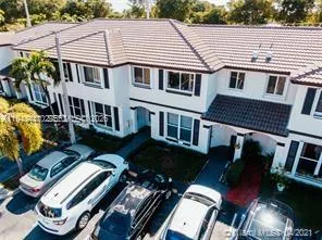 a aerial view of a house with pool table and chairs