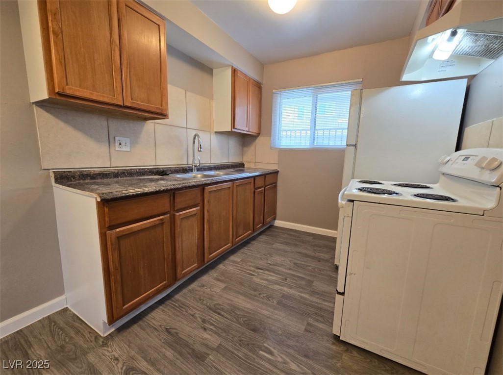 Undisclosed Address Las Vegas, NV 89101 - Photo 8 of 11 Kitchen featuring white electric range, under cabi