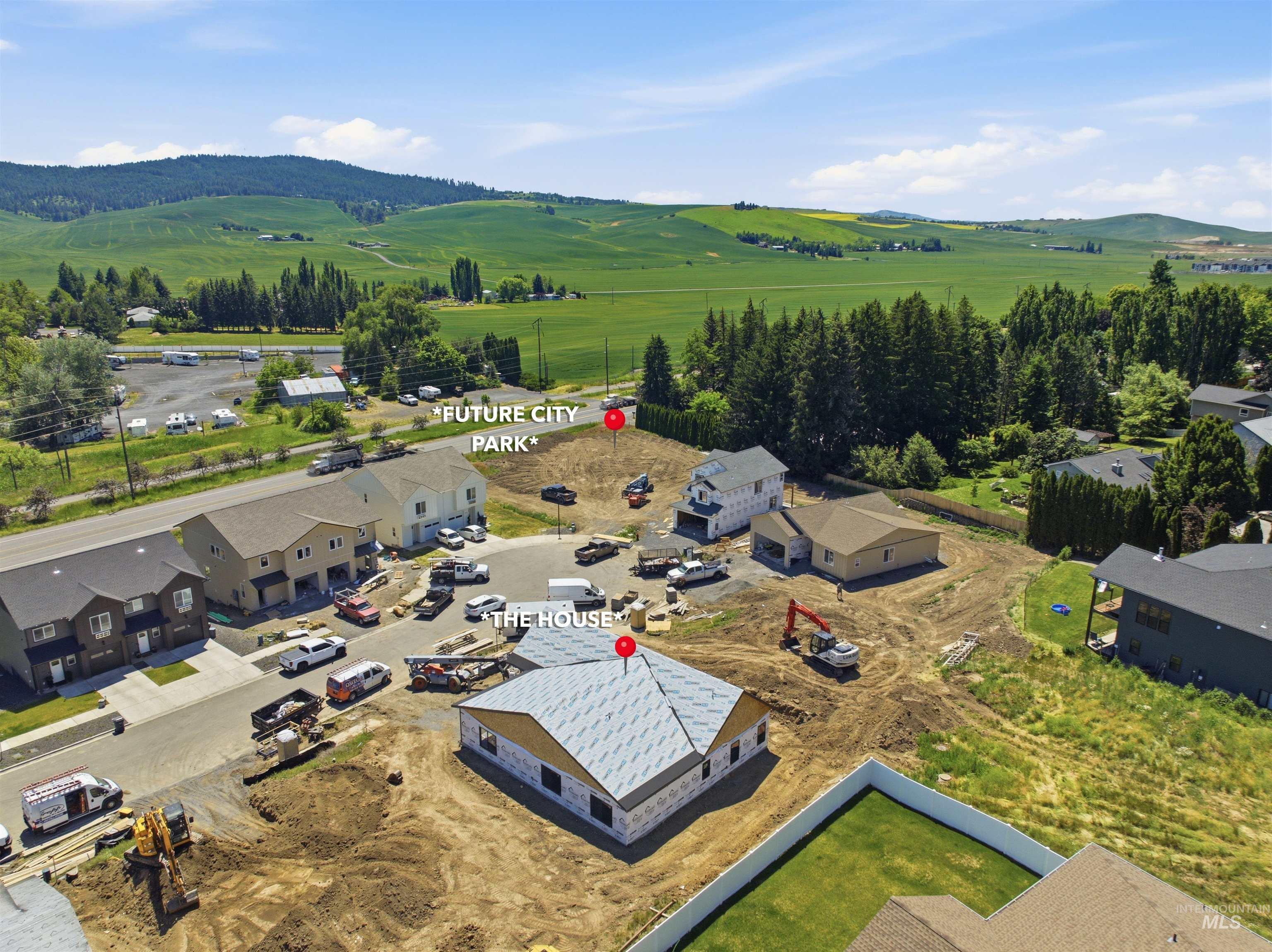 2824 Cyprus Court Moscow, ID 83843 - Photo 18 of 20 New construction property featuring an unlandscaped lot, partial roofing, and surrounding undeveloped terrain
