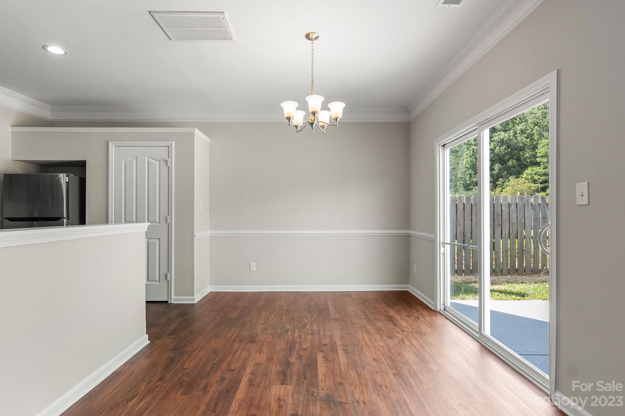 3808 Herkimer Drive Monroe, NC 28110 - Photo 11 of 40 a view of empty room with wooden floor and fan