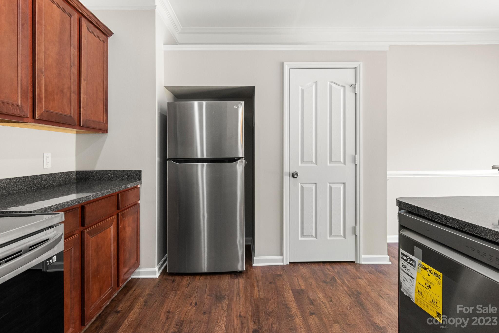 3808 Herkimer Drive Monroe, NC 28110 - Photo 14 of 40 a kitchen with a refrigerator and a stove top oven