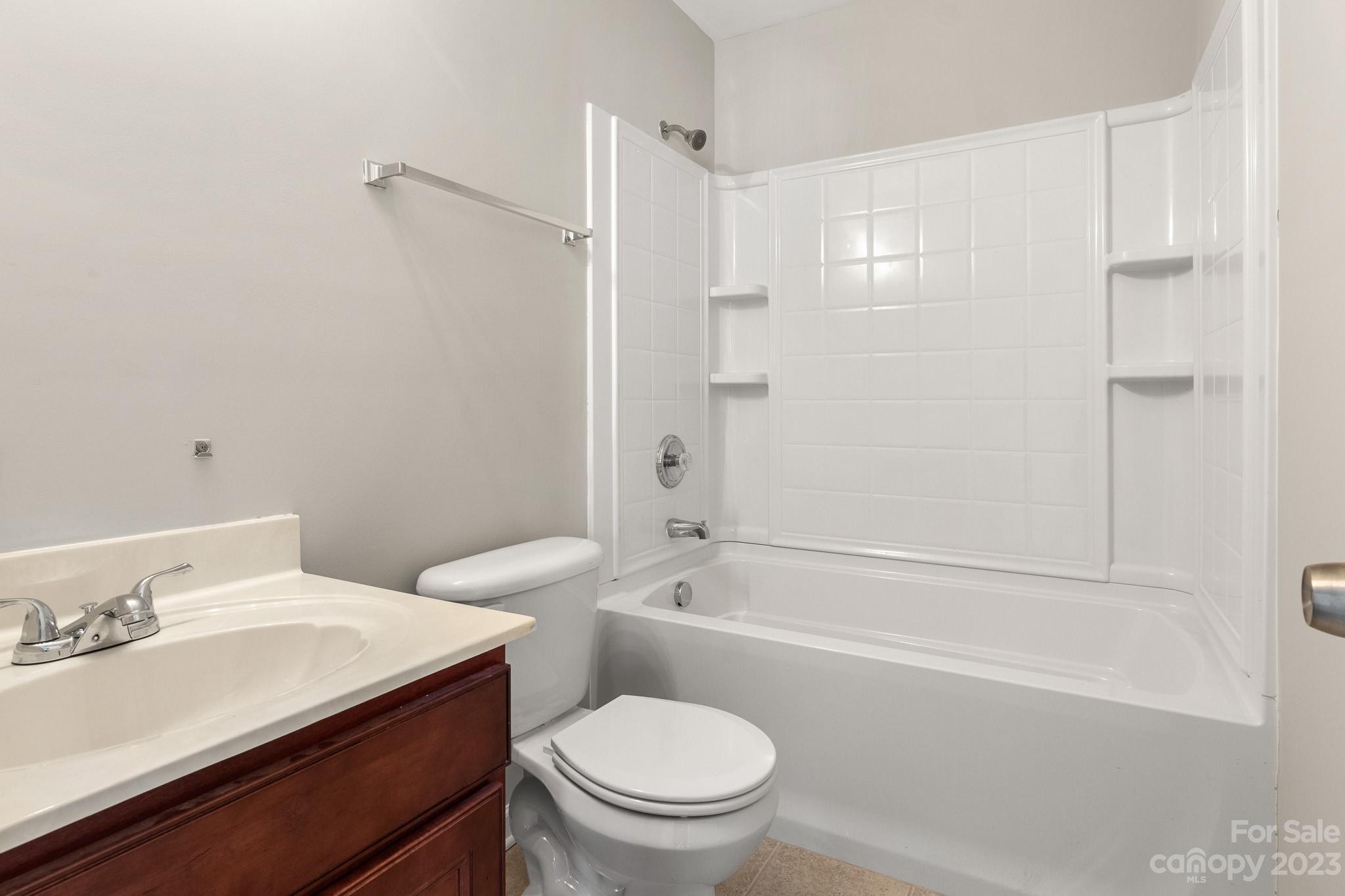 3808 Herkimer Drive Monroe, NC 28110 - Photo 26 of 40 a bathroom with a sink a toilet and a bathtub