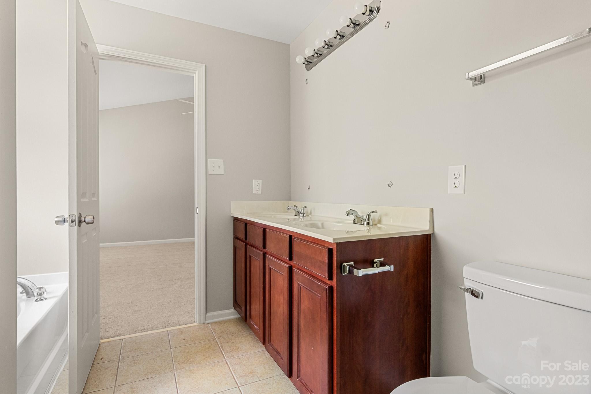 3808 Herkimer Drive Monroe, NC 28110 - Photo 31 of 40 a bathroom with a sink a toilet and shower