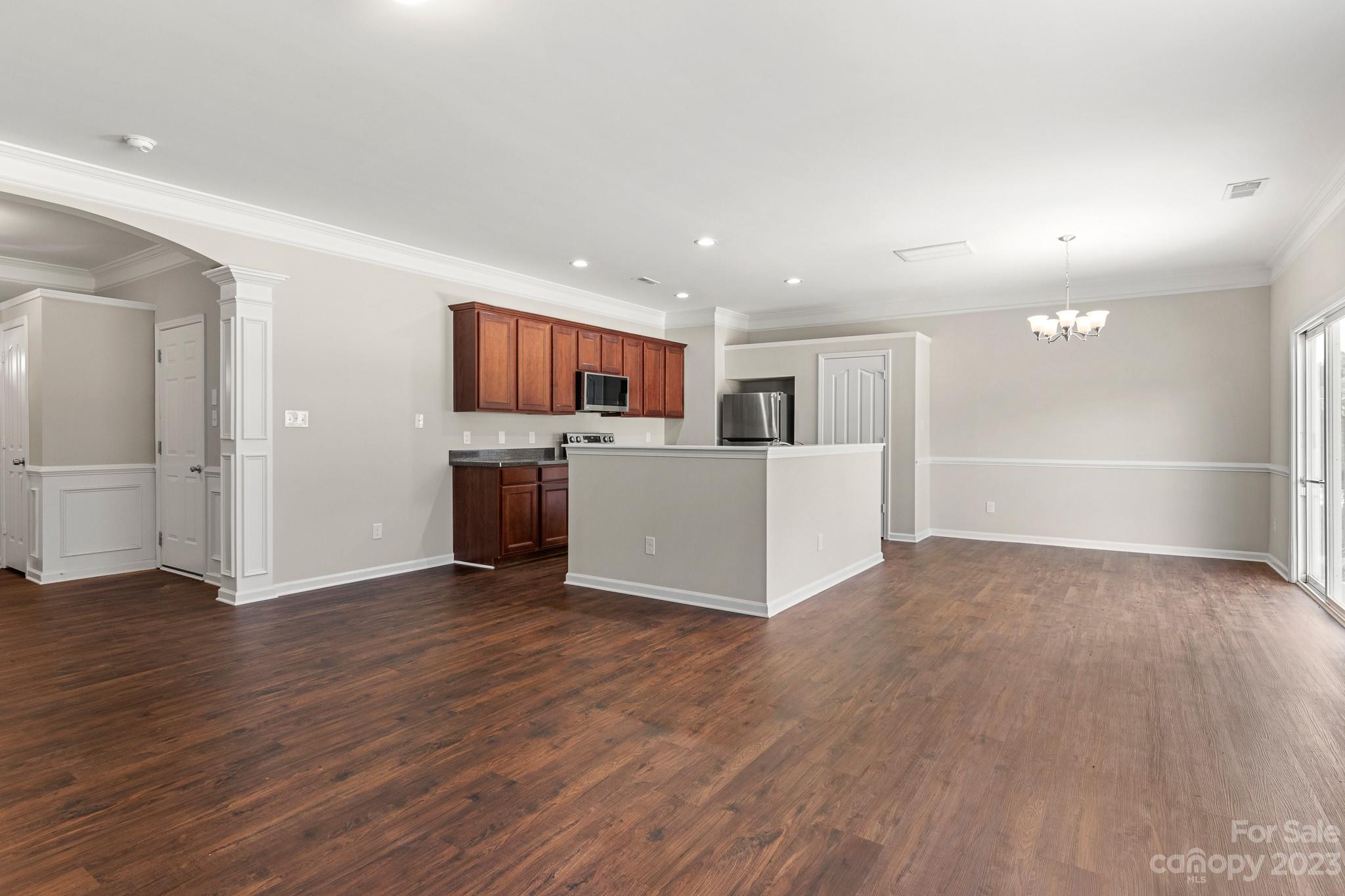3808 Herkimer Drive Monroe, NC 28110 - Photo 10 of 40 a view of kitchen and kitchen with wooden floor