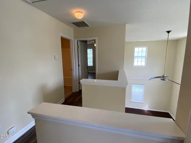 a living room with a furniture and a window