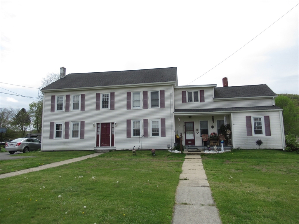 266 Palmer Road Monson, MA 01057 - Photo 1 of 40 a front view of house with yard and green space