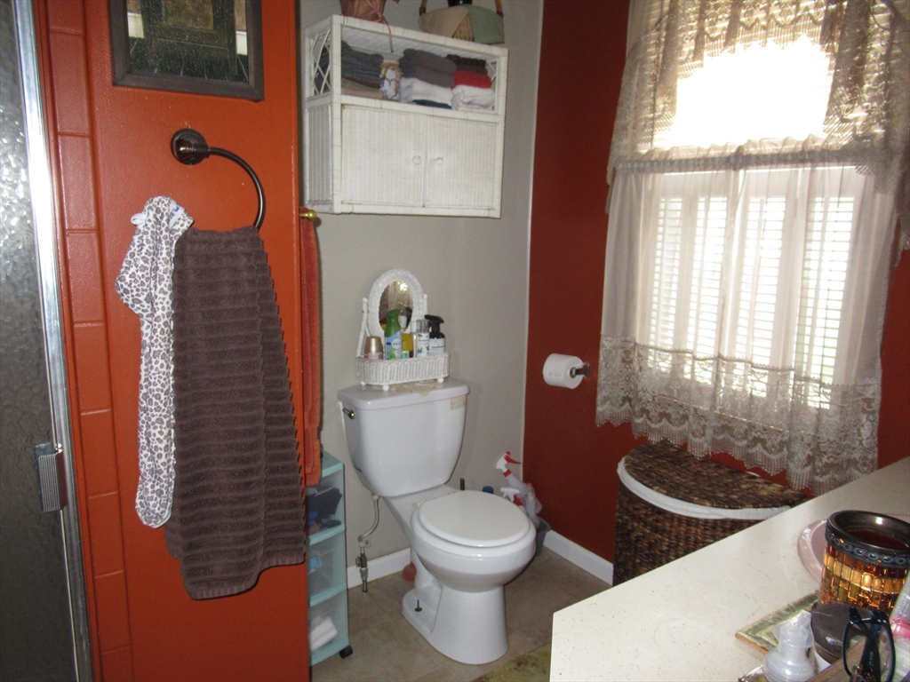 266 Palmer Road Monson, MA 01057 - Photo 13 of 40 a bathroom with a toilet a sink and a window