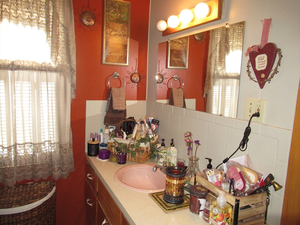 266 Palmer Road Monson, MA 01057 - Photo 14 of 40 a bathroom with a sink mirror and window
