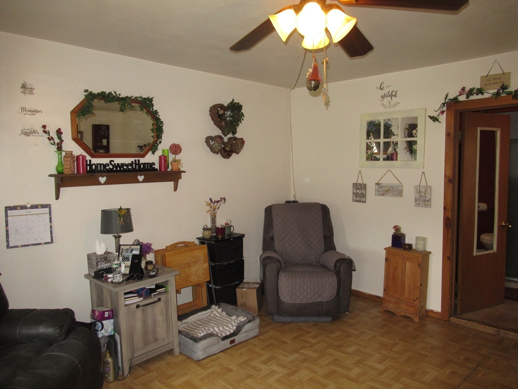 266 Palmer Road Monson, MA 01057 - Photo 19 of 40 a living room with furniture and a flat screen tv
