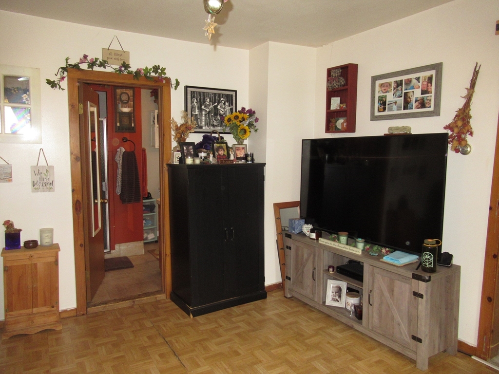266 Palmer Road Monson, MA 01057 - Photo 20 of 40 a view of a livingroom with furniture and a flat screen tv