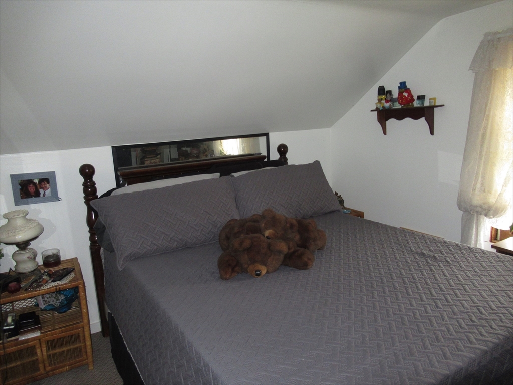 266 Palmer Road Monson, MA 01057 - Photo 23 of 40 a bedroom with a bed and cabinets