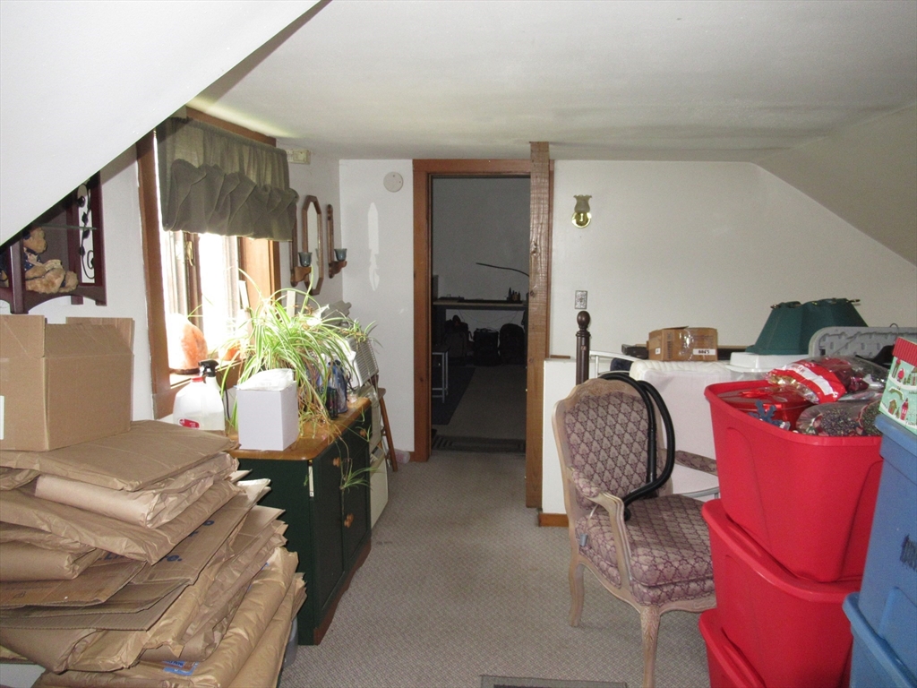 266 Palmer Road Monson, MA 01057 - Photo 25 of 40 a living room with furniture and a fireplace