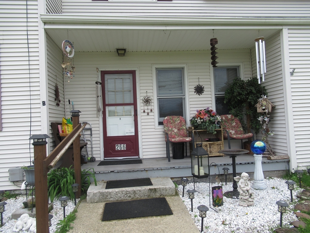 266 Palmer Road Monson, MA 01057 - Photo 3 of 40 a front view of a house with a porch
