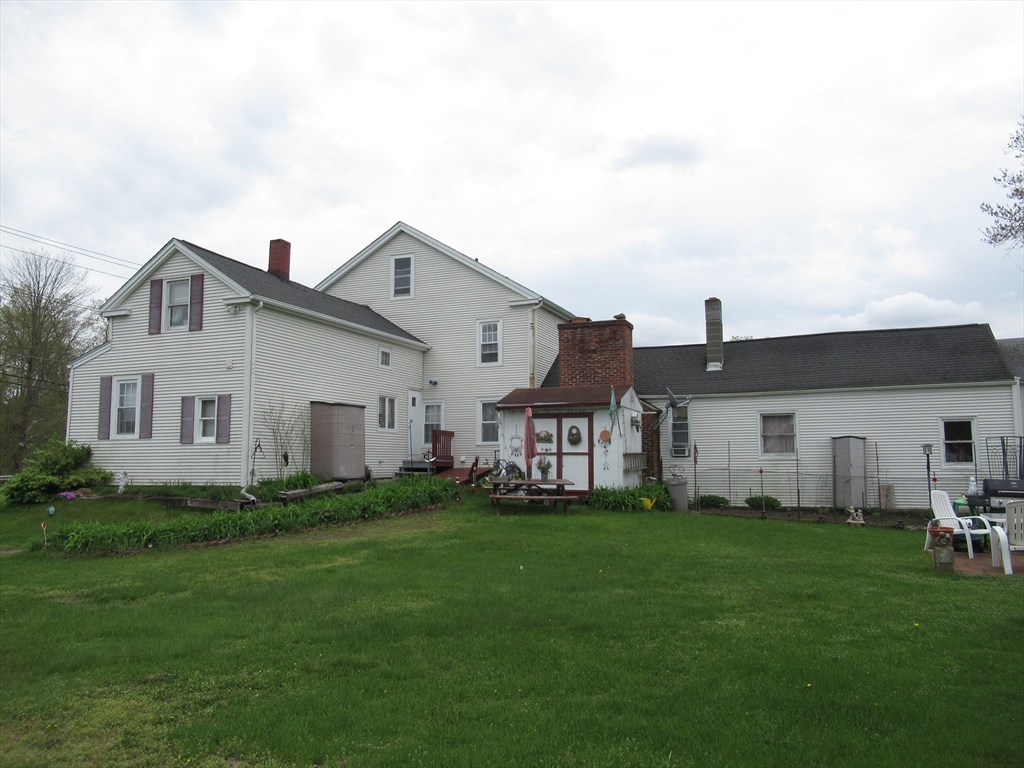 266 Palmer Road Monson, MA 01057 - Photo 35 of 40 a view of a house with a yard and sitting area