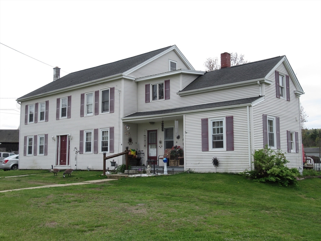 266 Palmer Road Monson, MA 01057 - Photo 36 of 40 a front view of a house with a garden