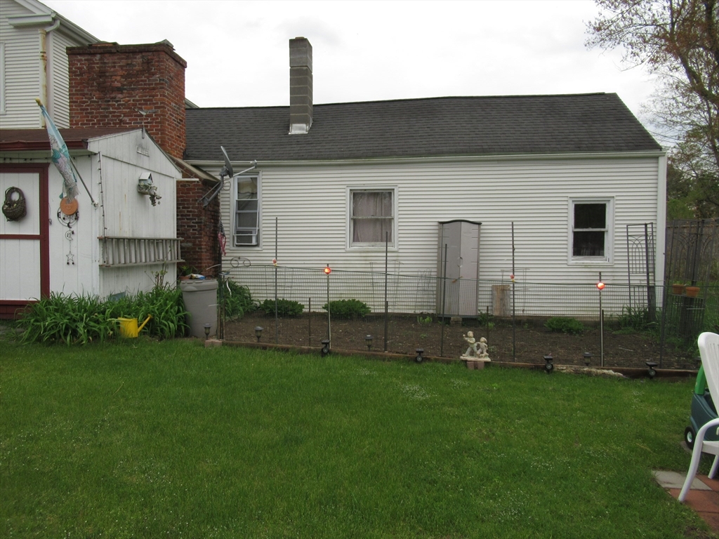 266 Palmer Road Monson, MA 01057 - Photo 37 of 40 a front view of a house with a garden