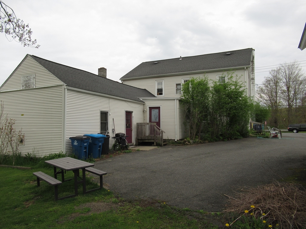 266 Palmer Road Monson, MA 01057 - Photo 39 of 40 a backyard of a house with table and chairs