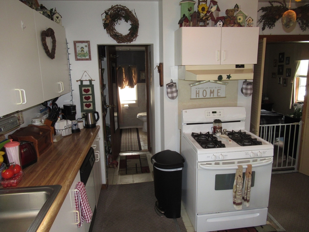 266 Palmer Road Monson, MA 01057 - Photo 5 of 40 a kitchen with stainless steel appliances granite countertop a stove and a refrigerator