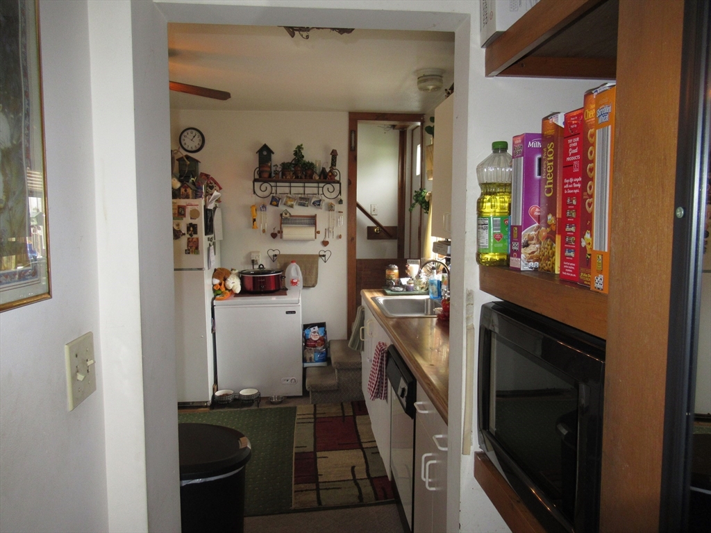 266 Palmer Road Monson, MA 01057 - Photo 7 of 40 a storage room with washer and dryer