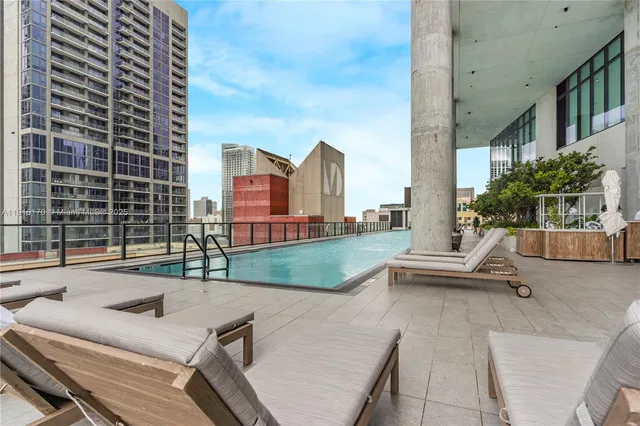 a view of a porch with a floor to ceiling window