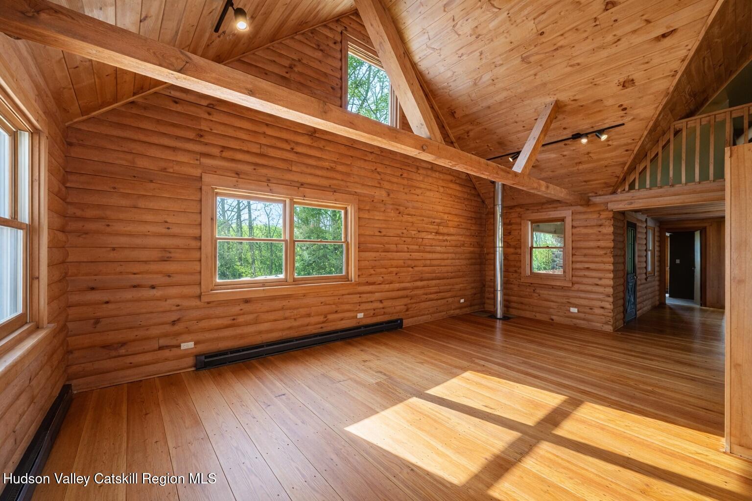 380 Easy Street Catskill, NY 12414 - Photo 18 of 57 a view of a room with wooden floor and windows
