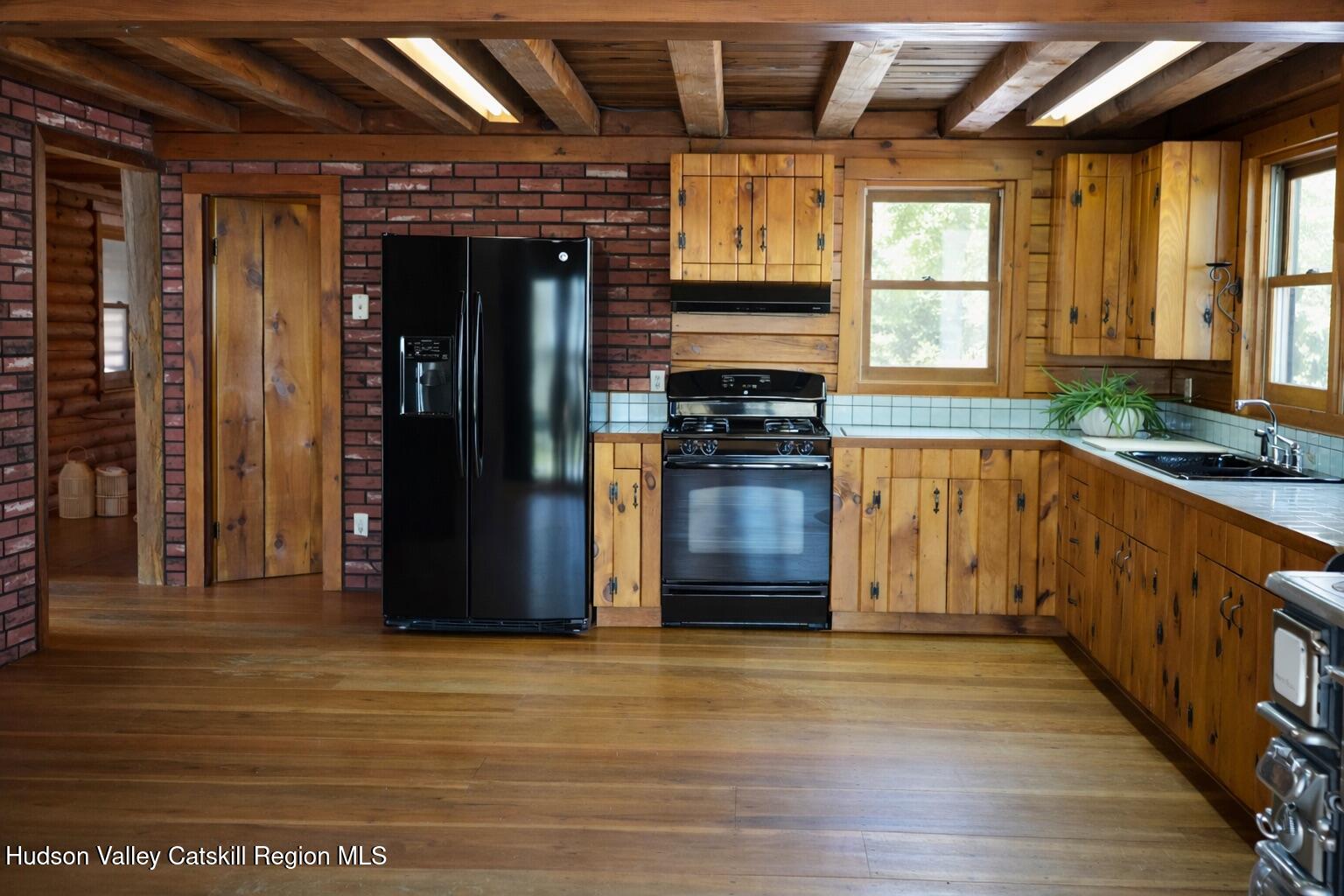 380 Easy Street Catskill, NY 12414 - Photo 20 of 57 a kitchen with stainless steel appliances granite countertop a refrigerator and a stove
