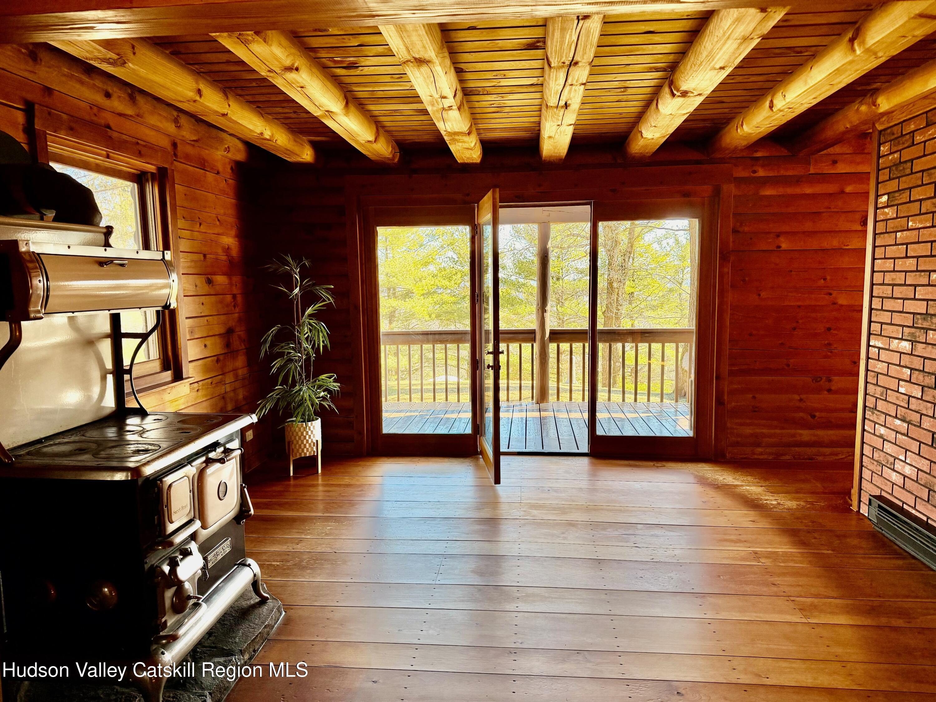 380 Easy Street Catskill, NY 12414 - Photo 24 of 57 a view of an empty room with window and wooden floor