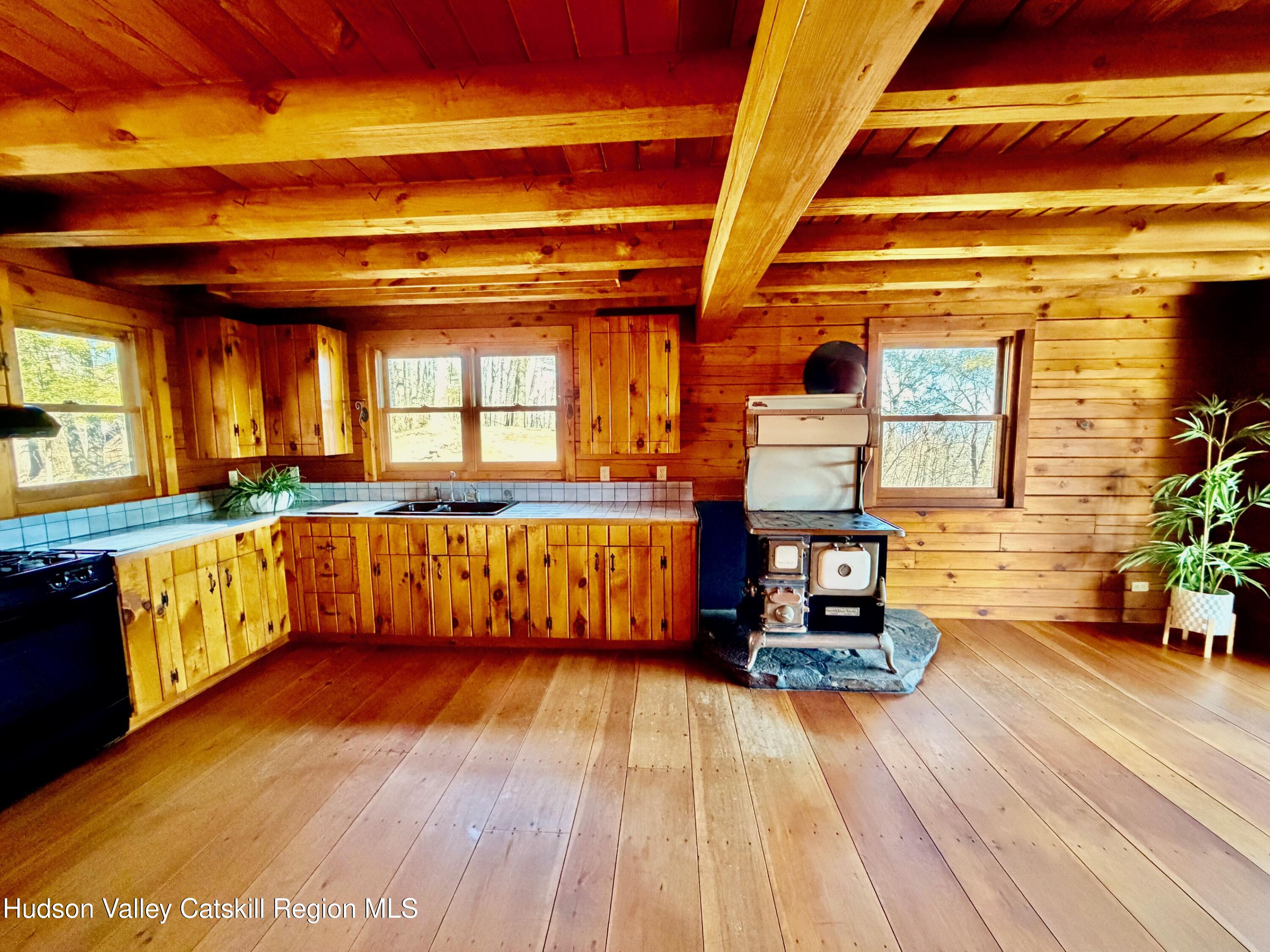380 Easy Street Catskill, NY 12414 - Photo 25 of 57 a view of kitchen with furniture and wooden floor