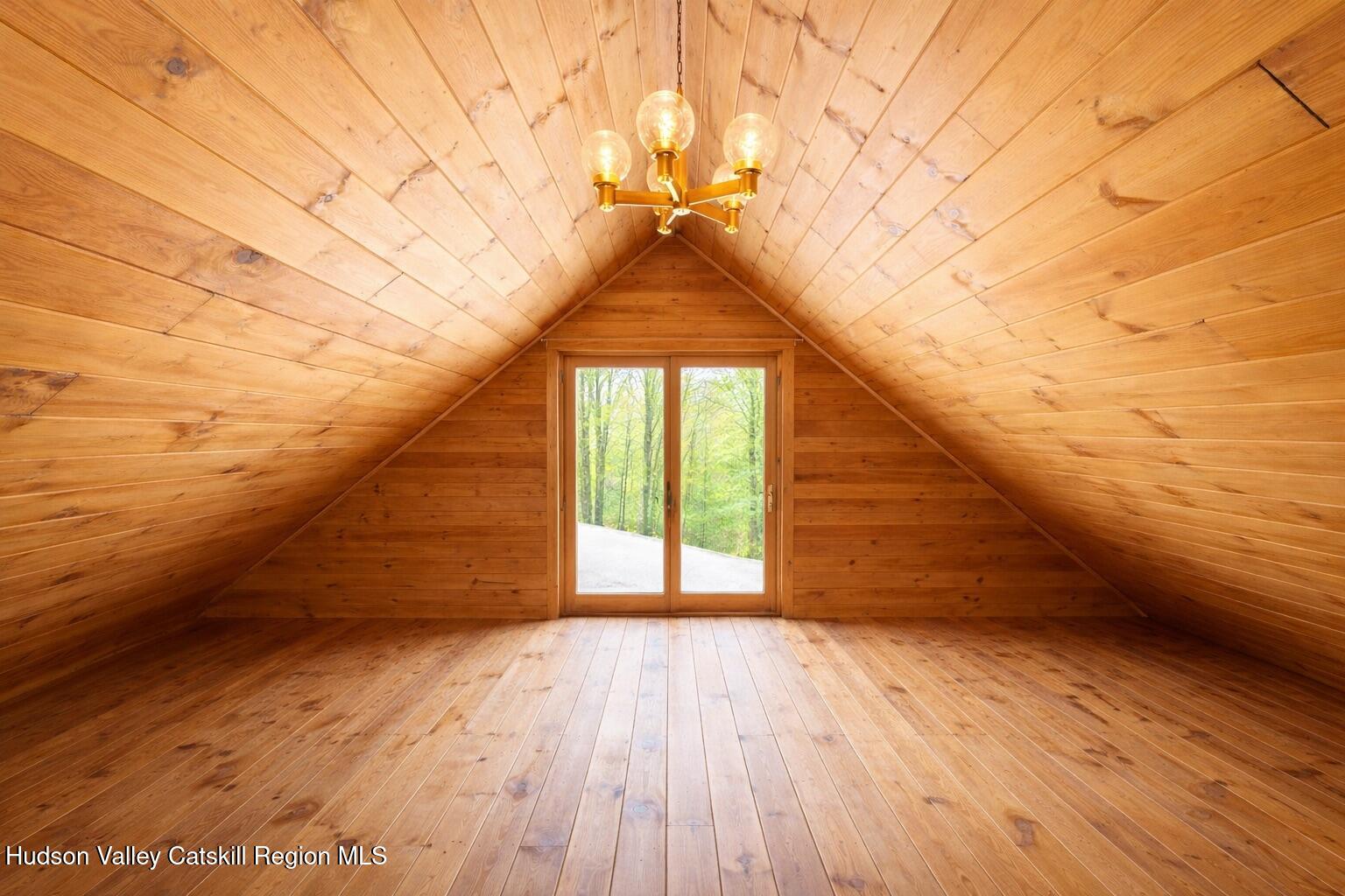 380 Easy Street Catskill, NY 12414 - Photo 36 of 57 a view of empty room with wooden floor and fan