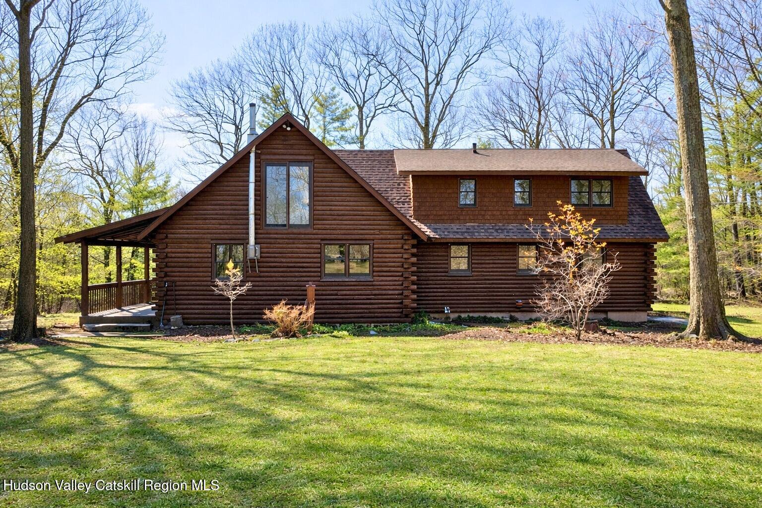 380 Easy Street Catskill, NY 12414 - Photo 5 of 57 a view of backyard with a garden and trees