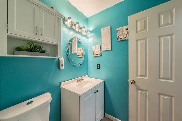 a bathroom with a sink a washer and dryer