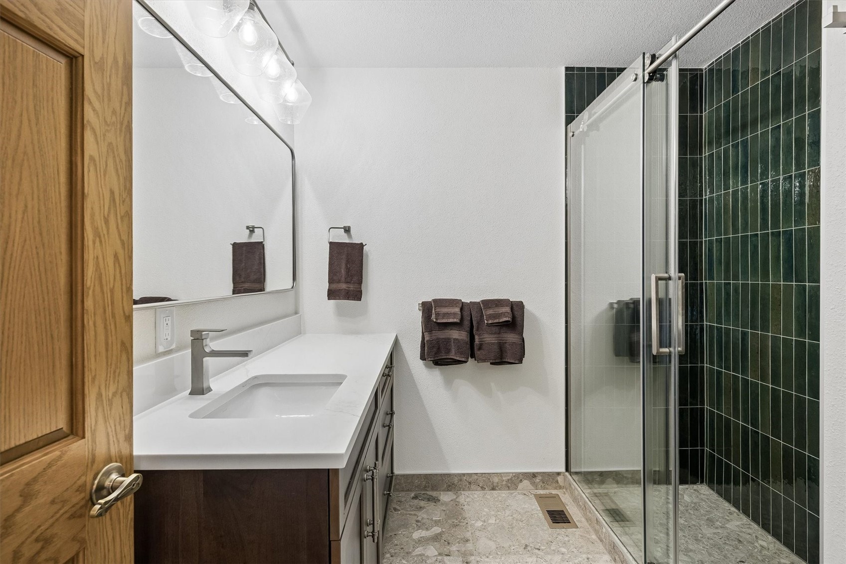 51 West Ranch Trail Morrison, CO 80465 - Photo 41 of 50 a bathroom with a sink and a mirror