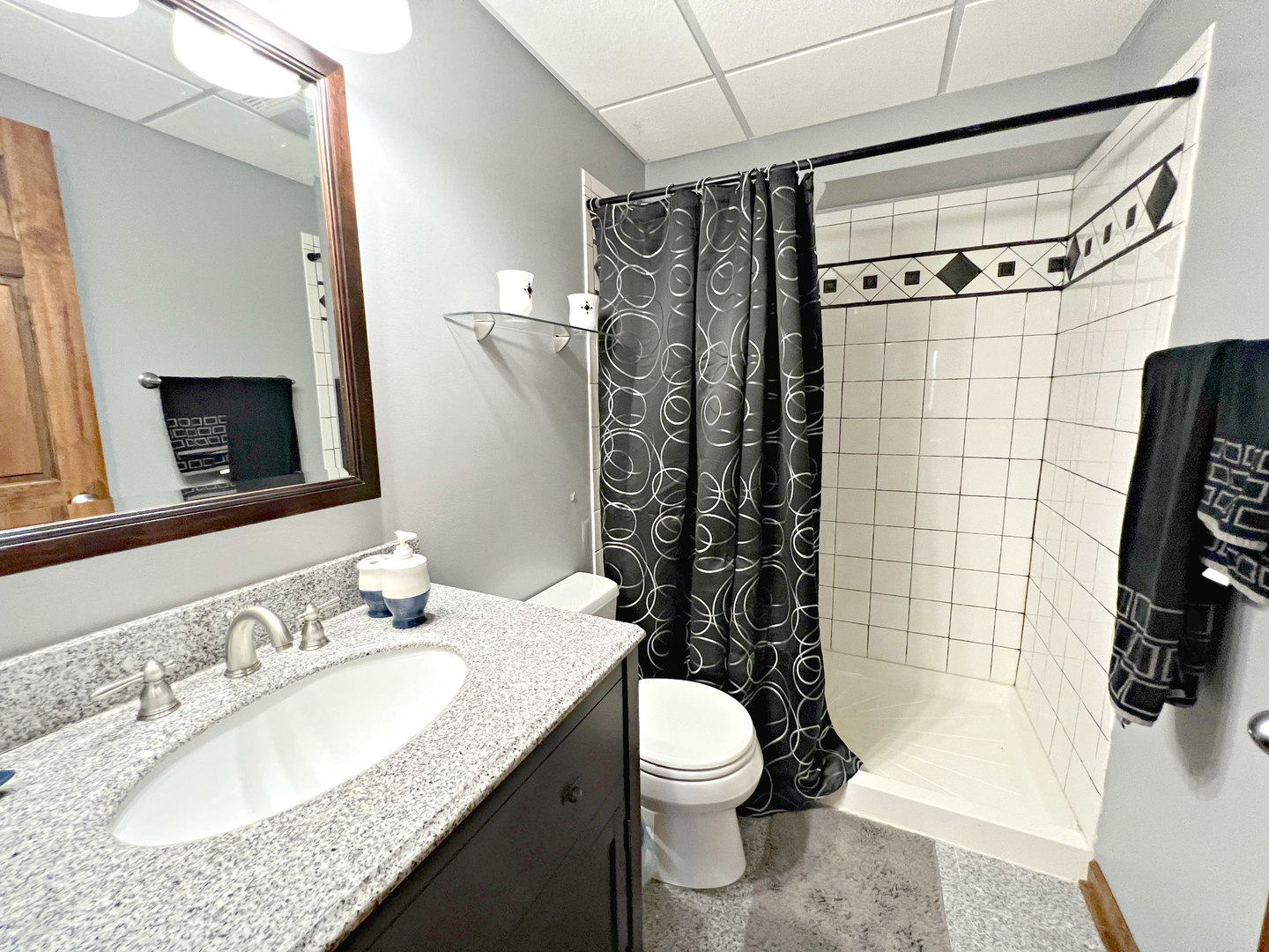 14508 Nichols Road Hebron, IL 60034 - Photo 22 of 38 a bathroom with a granite countertop sink toilet and shower