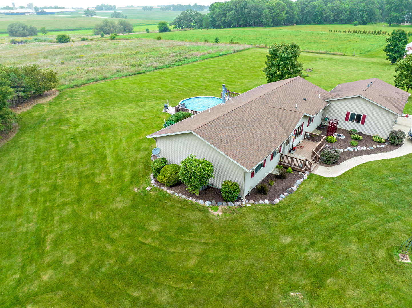14508 Nichols Road Hebron, IL 60034 - Photo 5 of 38 a view of a garden with an outdoor space and seating area