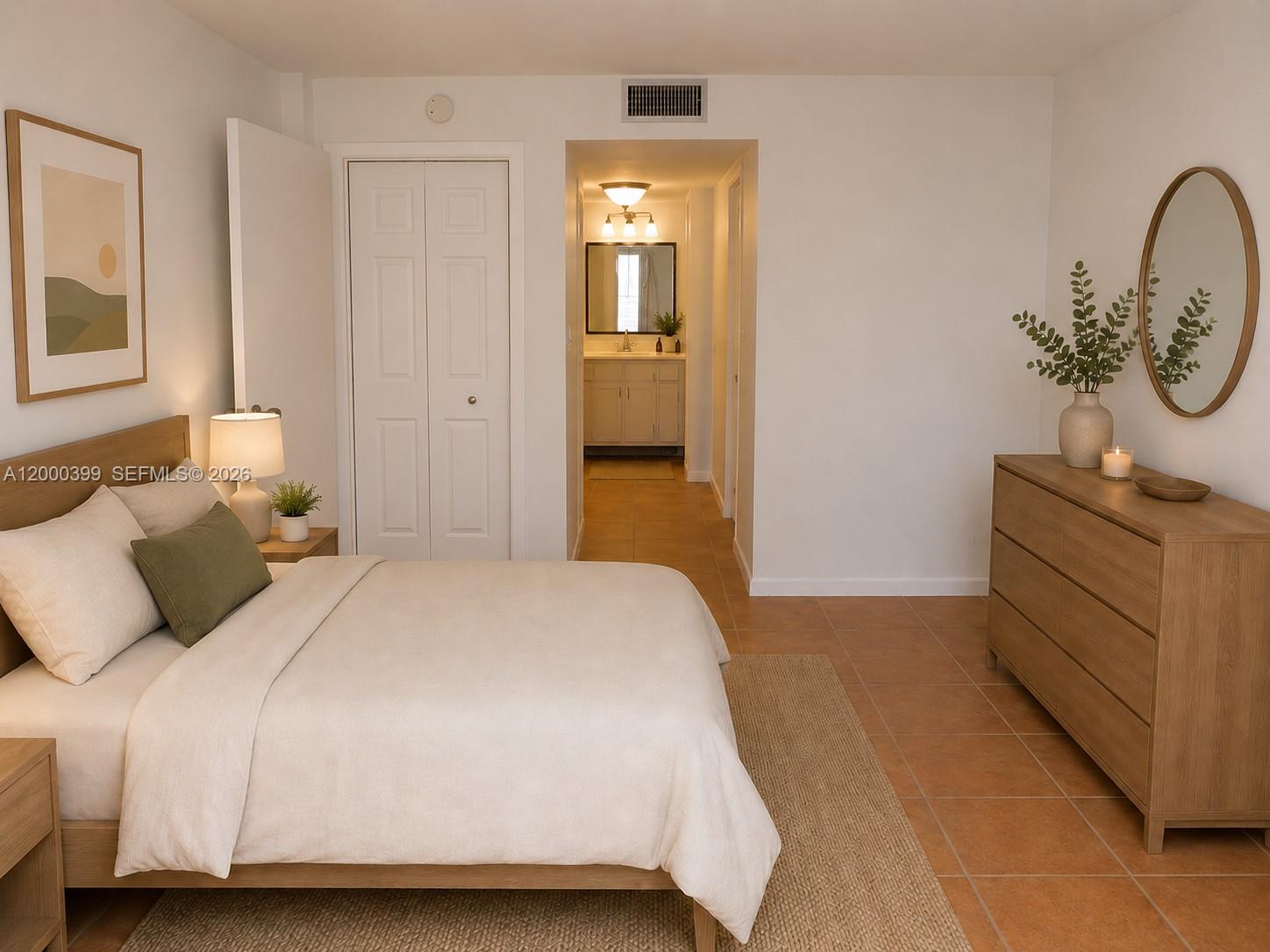 8050 West McNab Road, Unit 206 Tamarac, FL 33321 - Photo 17 of 37 a bedroom with a bed and a dresser