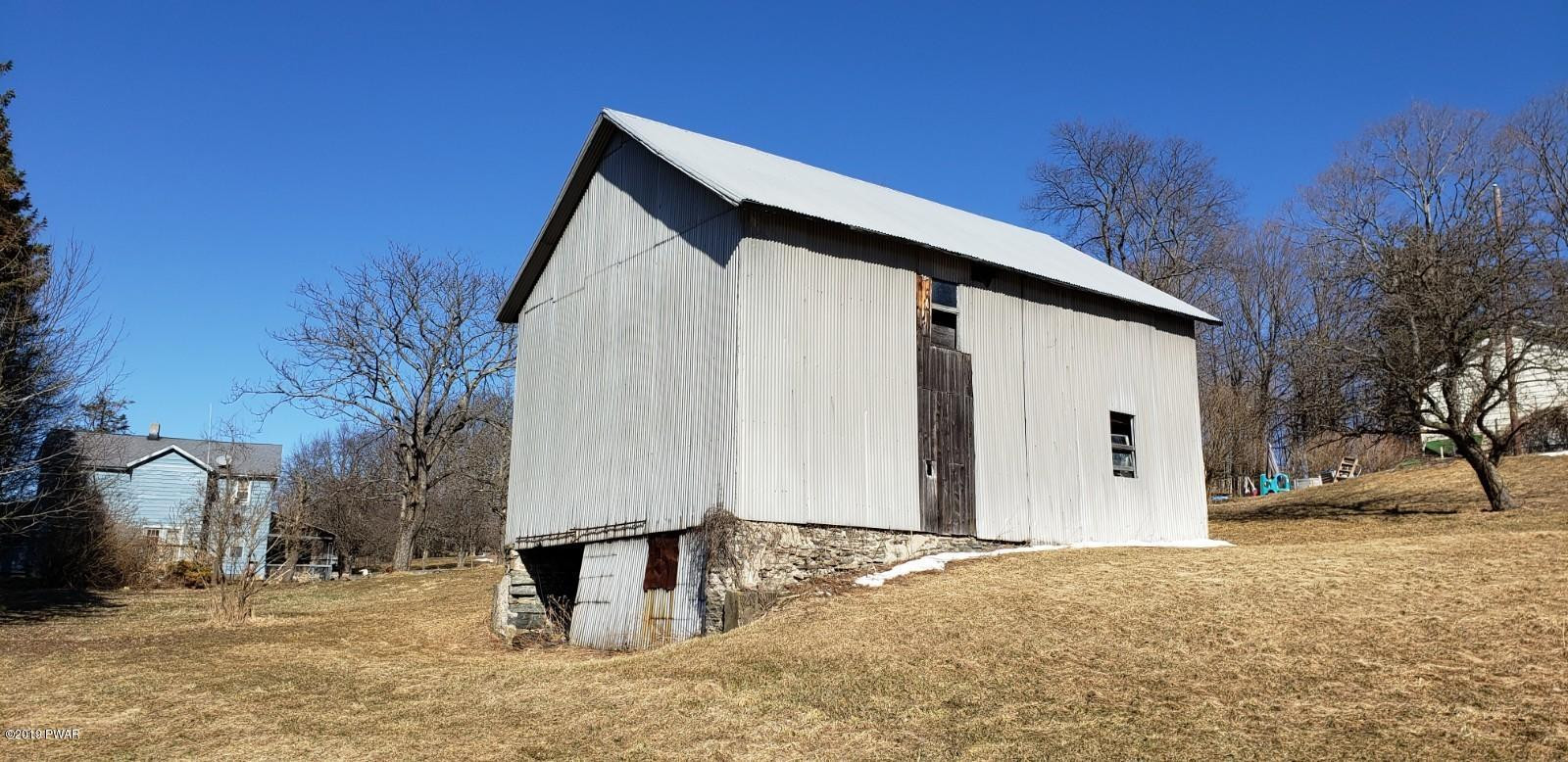 378 Gravity Road Lake Ariel, PA 18436 - Photo 6 of 10 a view of a house with a yard