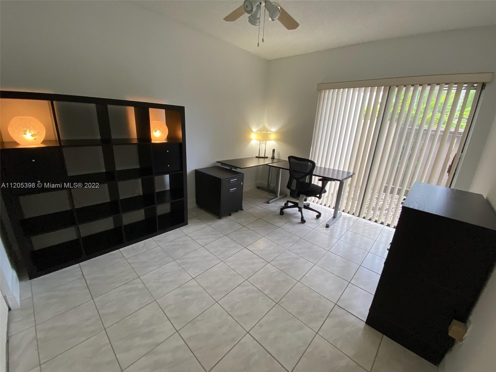 10478 Southwest 75th Lane Miami, FL 33173 - Photo 11 of 45 a view of a livingroom with furniture and a window